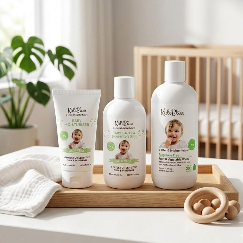 Step 2 | Essential Newborn Purity Bundle: Barrier Repair Starter Set products on a wooden tray with a baby toy.